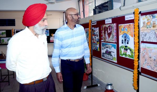 Dr. P.S. Brar and Dr. SPS Ghuman witnessing art work of the students